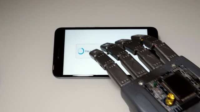 The robot arm uses the smartphone and disables the protection.