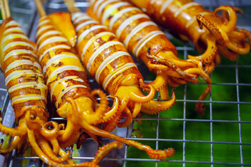 exotic asian food, grilled squid stuffed with seafood
