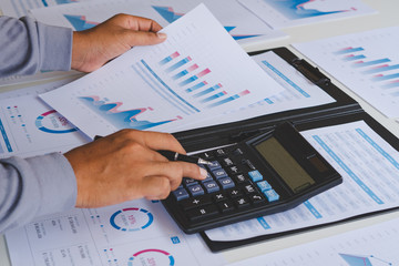 businessman working calculate data document graph chart report marketing research development  planning management strategy analysis financial accounting. Business office concept.