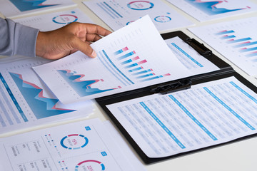businessman working calculate data document graph chart report marketing research development  planning management strategy analysis financial accounting. Business office concept.