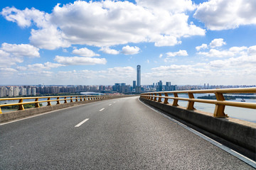 city skyline with road