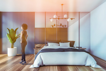 African woman in blue master bedroom