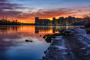 Fototapeta premium Bright December dawn on the Neva river in Rybatskoye district in