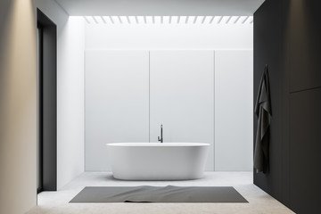 Fototapeta na wymiar White and gray minimalistic bathroom with tub