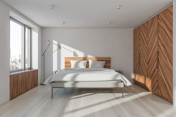 Fototapeta na wymiar White and wooden master bedroom with wardrobe