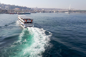 pleasure boat on the sea. waves astern