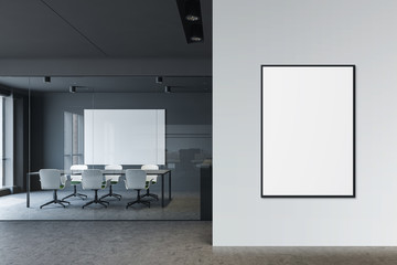 Gray conference room with vertical poster