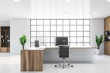 White CEO office interior with wooden table