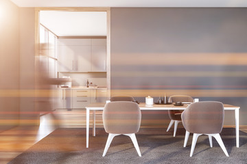 Man walking in gray dining room