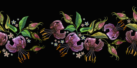 Horizontal seamless pattern. Embroidery tiger lillies on black background. Fashion clothes template, t-shirt design
