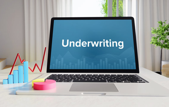 Underwriting – Statistics/Business. Laptop in the office with term on the Screen. Finance/Economy.