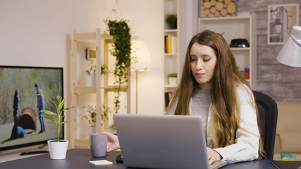 Girl working on laptop from home office