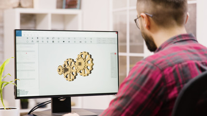 Male engineer working on a 3d design from home - obrazy, fototapety, plakaty