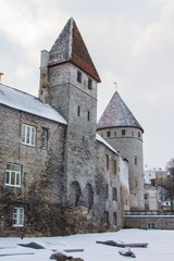 Fototapeta na wymiar Historic defense towers in Old Town of Tallin in winter. Estonia