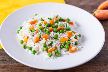 Basmati rice with carrots and green peas.