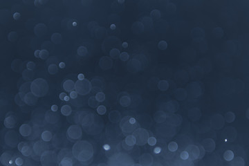 abstract sparkle bokeh light effect with navy blue background