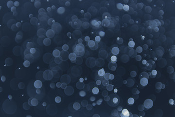 abstract sparkle bokeh light effect with navy blue background