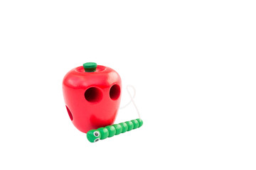 Wooden educational toy apple with a caterpillar.