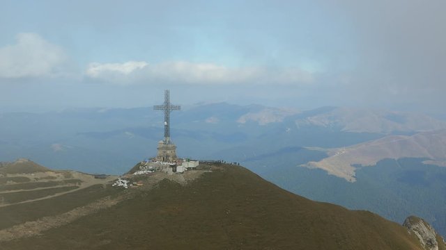 Clouds over Caraiman Cross Heroes Monument on Bucegi Mountains, Romania