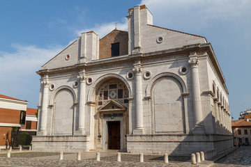 Fototapeta na wymiar Unfinished church facade in the historic centre of Rimini, Italy