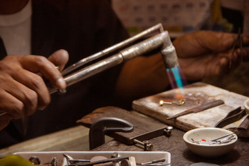 Selective focus on master's hand in dark low key night tone