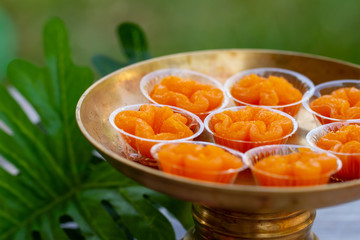Thai desserts, Tong Yip (Flower Egg Yolk Tart) Egg yolk, sugar, and flower water boiled in sugar syrup and formed into flower like shape