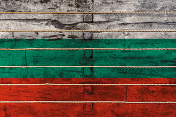 National flag  of Bulgaria. on a wooden wall background. The concept of national pride and a symbol...