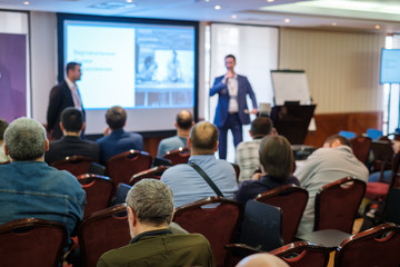 Audience listens lecturer at workshop