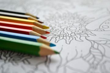 Zen art, doodle patterns in black and white with multicolored pens rainbow colored lay on it. Zen Doodle, zen tangle illustration, coloring books for adult and kids. Copy space, place for text