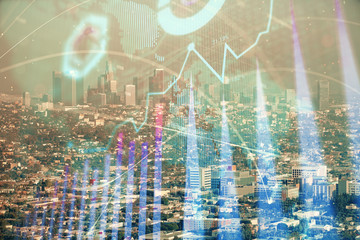 Forex chart on cityscape with skyscrapers wallpaper double exposure. Financial research concept.