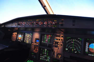 Flight deck of an Airbus 319 in flight, First Officer View - obrazy, fototapety, plakaty
