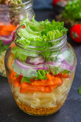healthy salad in a jar (vegetable snack pasta salad) menu concept. food background. top view. copy space