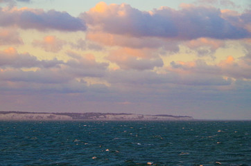 Amazing and beautiful sunrise or sunset over the English Channel or sea with sun and sky on fire...