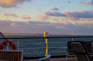 Vacation and traveling on luxury cruise ship liner with beautiful panoramic sunrise or sunset over...