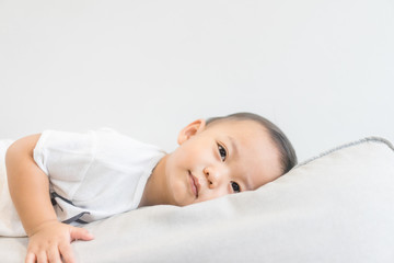 Toddler boy sleeping in sofa and dream.Asian 2 years old baby boy sleep on the sofa in living room.Sleep time,Comfortable, peaceful and growth hormone concept.