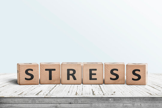 The word stress on a sign made of wooden blocks