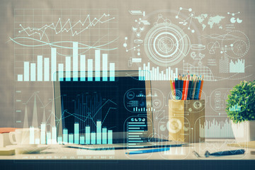 Double exposure of forex chart and work space with computer. Concept of international online trading.