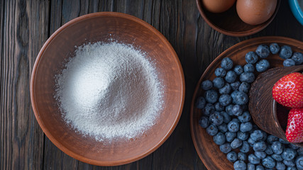 Flour, eggs, sugar, eggs and fresh berries are the ingredients for a delicious pie. Blueberry pie