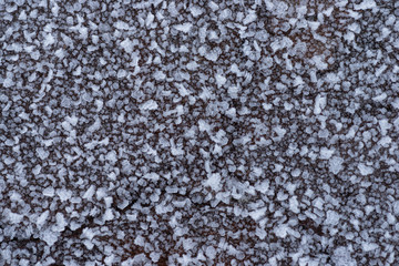 Texture macro of frost on a wooden Board