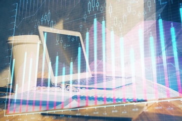 Forex market chart hologram and personal computer background. Multi exposure. Concept of investment.