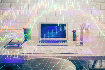 Forex market graph hologram and personal computer on background. Multi exposure. Concept of investment.