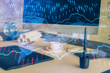 Forex market graph hologram and personal computer on background. Multi exposure. Concept of investment.