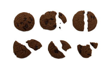 Biscuit with chocolate chip flavored. Some broken and crumbs of crunchy delicious sweet meal and useful cookie. Isolated on white background.