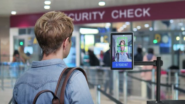 Facial Recognition System New Technology Woman Goes  Through Airport Security Control