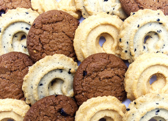 Collection of cookies and biscuit with different flavor, chocolate chip butter, vanilla and black sesame. On white background.