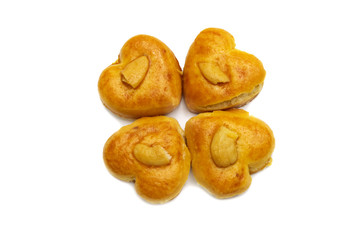 Cashew nut or Singapore cookies of heart shape isolated on white background for valentine's day or other celebration element concept design.