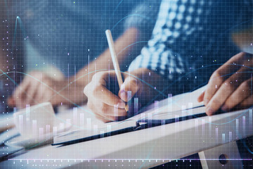 Multi exposure of two men planing investment with stock market forex chart.