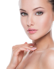 Fototapeta premium portrait of young beautiful woman with hands at face