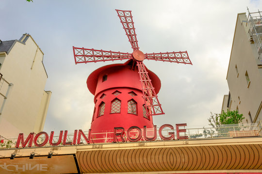 Paris, France - July 1, 2017: close up of the Moulin Rouge nightclub and historical theater, most famous cabaret attraction of Paris. The Moulin Rouge is a symbol of Pigalle District.