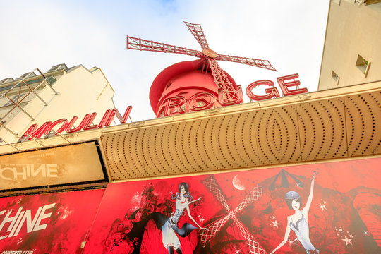 Paris, France - July 1, 2017: signboard of the Moulin Rouge nightclub and historical theater, most famous cabaret attraction of Paris. The Moulin Rouge is a symbol of Pigalle District.